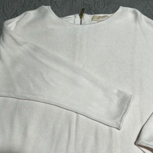 Cream colored Michael Kors sweater back zipper.
